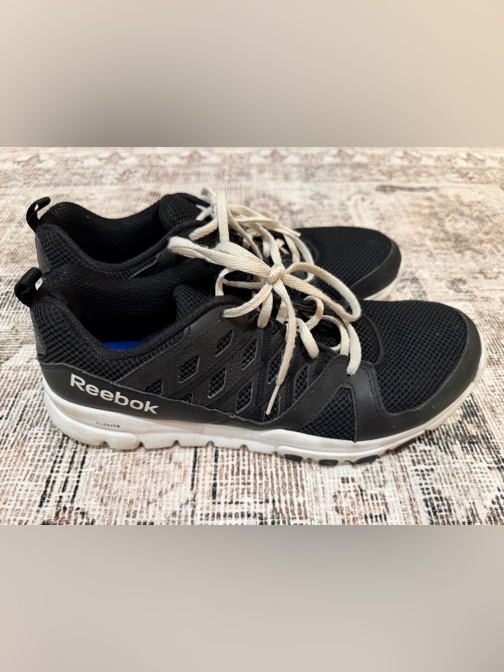 Reebok Black Athletic Sneakers with White Soles and Laces